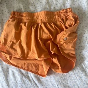 orange lululemon hotty hot shorts 2.5” size 4